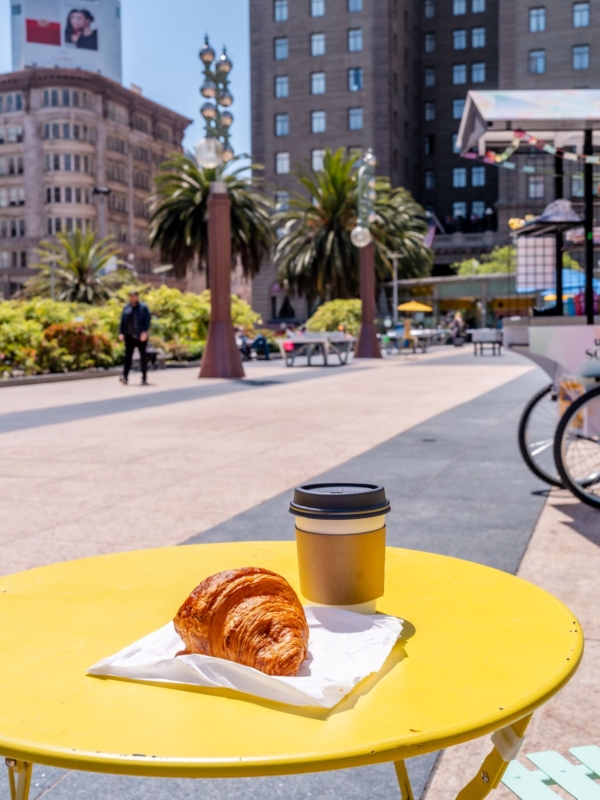 croissant and coffee on a table in union square in san fransisco