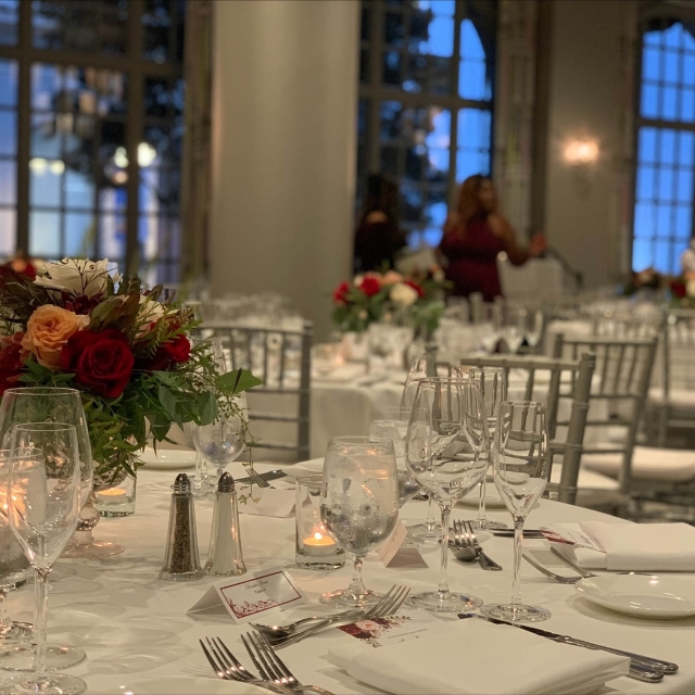 Close up of a table set up for a wedding at The Marker with people in the background