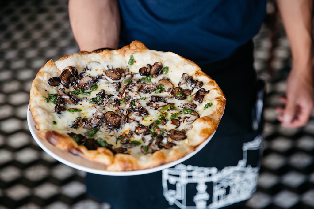 A close up of pizza prepared by Tratto at The Marker