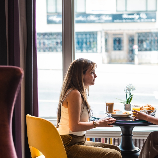 Two people enjoying lunch while staying at The Marker