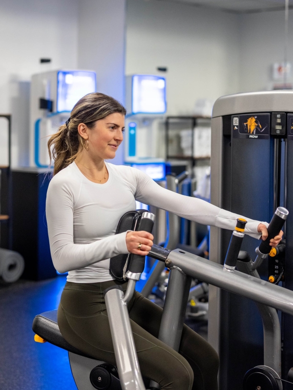 A close up of a woman working out at The Marker gym