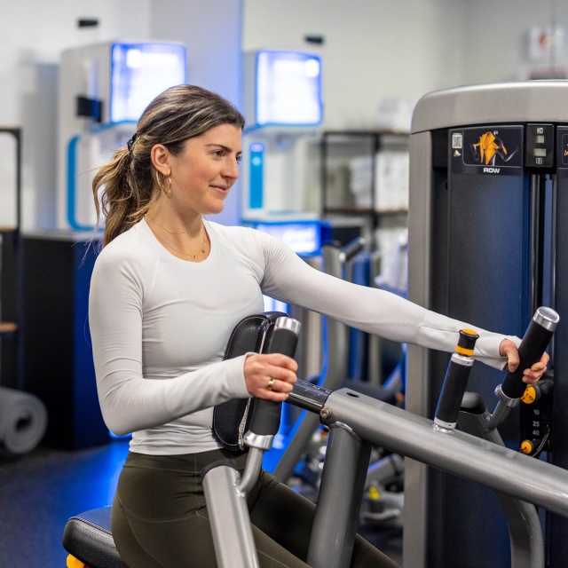 A close up of a woman working out at The Marker gym