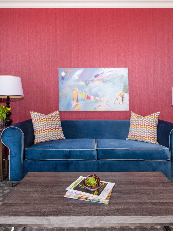 A blue couch in a living room at The Marker